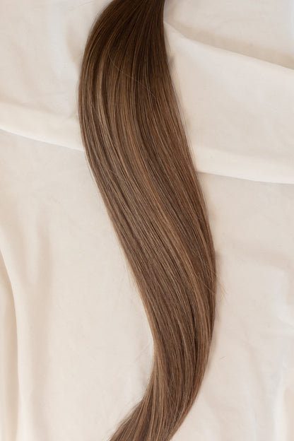 A High And Low Lightened Bronde Hair Extensions With A Level 4 Root 